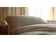 A serene bedroom with soft lighting, symbolizing restorative sleep