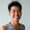 Photo of Robert L., a fit man in his late 40s in activewear, smiling confidently.